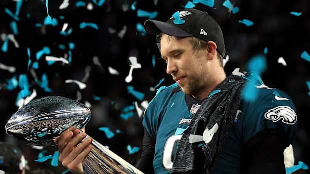 nick_foles_holding_trophy_lovingly.jpg